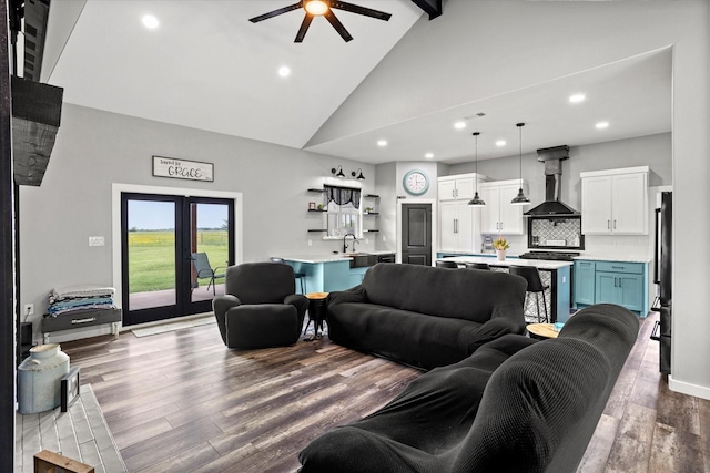 living area with ceiling fan, wood finished floors, high vaulted ceiling, beamed ceiling, and recessed lighting