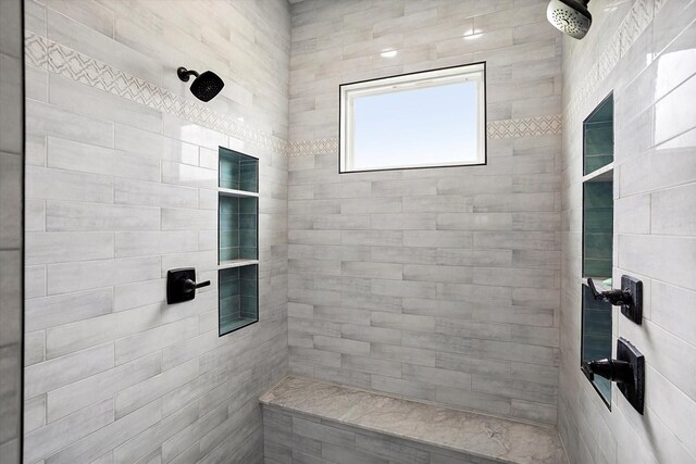 full bathroom with a tile shower