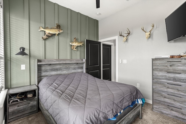 carpeted bedroom with a ceiling fan and baseboards