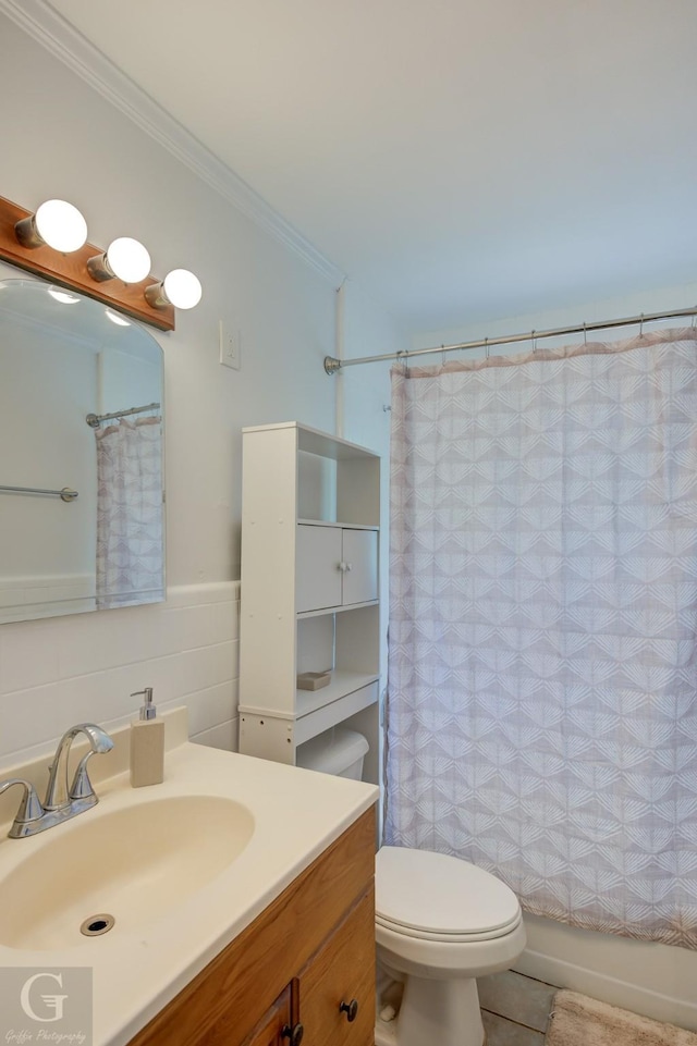 bathroom with crown molding, toilet, shower / bathtub combination with curtain, and vanity