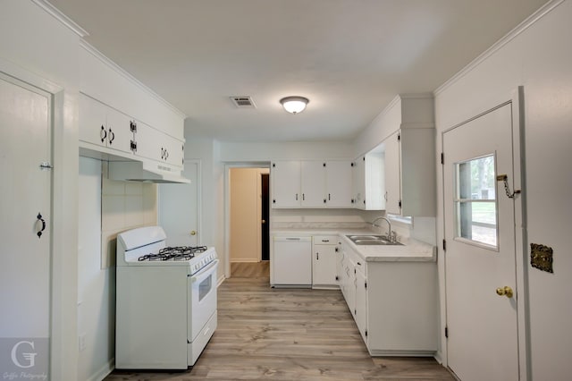 kitchen with visible vents, white appliances, light countertops, white cabinetry, and a sink
