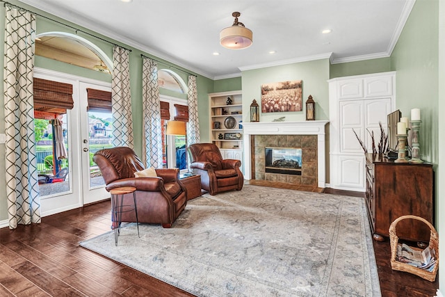 3906 Sharp Ln, Richardson, TX 75082 - sitting room with recessed lighting, ornamental molding, dark wood-style floors, and a fireplace