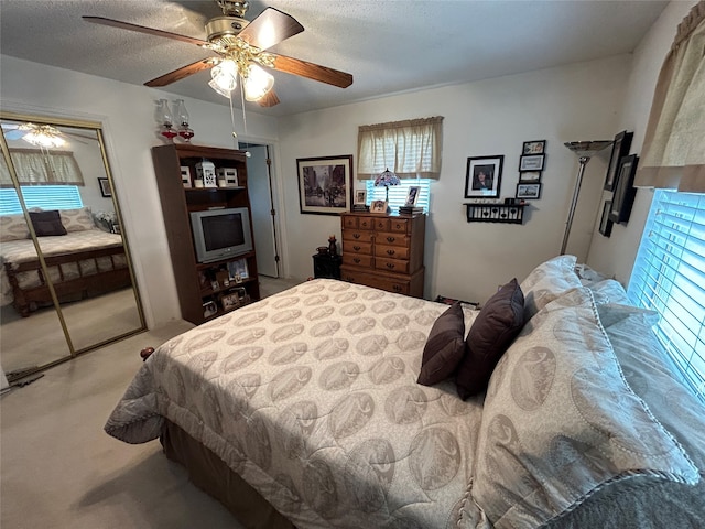 222 County Road 3331, Paradise, TX 76073 - carpeted bedroom featuring a ceiling fan and a textured ceiling