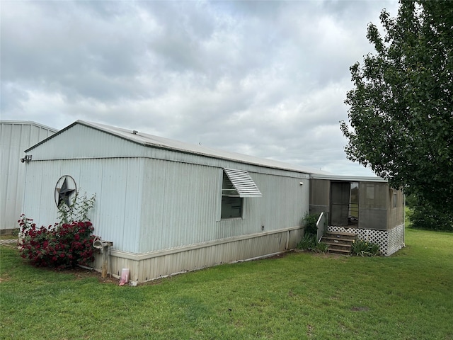 222 County Road 3331, Paradise, TX 76073 - view of home's exterior featuring a yard and a sunroom