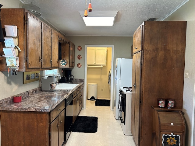 222 County Road 3331, Paradise, TX 76073 - kitchen with dark countertops, a sink, dishwasher, light floors, and gas range oven