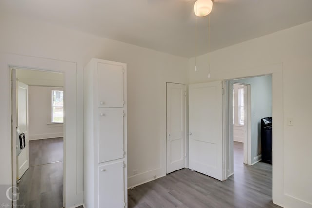 unfurnished bedroom featuring baseboards and wood finished floors
