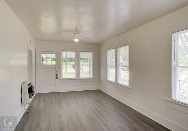 interior space featuring heating unit and a wealth of natural light
