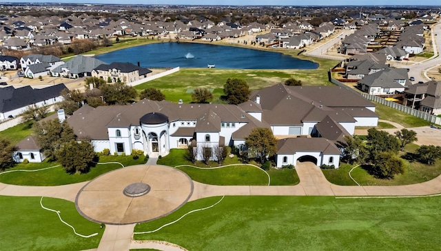 aerial view featuring a residential view and a water view