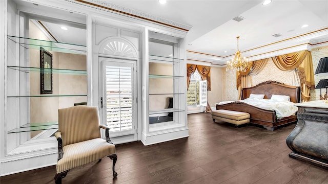 bedroom featuring crown molding, a chandelier, hardwood / wood-style flooring, and visible vents