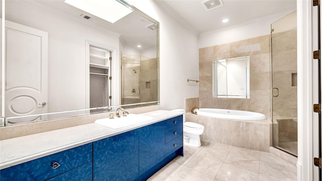 full bathroom with vanity, a shower stall, a bath, and visible vents