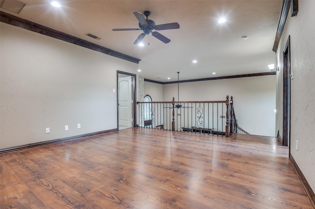 unfurnished room with crown molding, ceiling fan, recessed lighting, wood finished floors, and visible vents