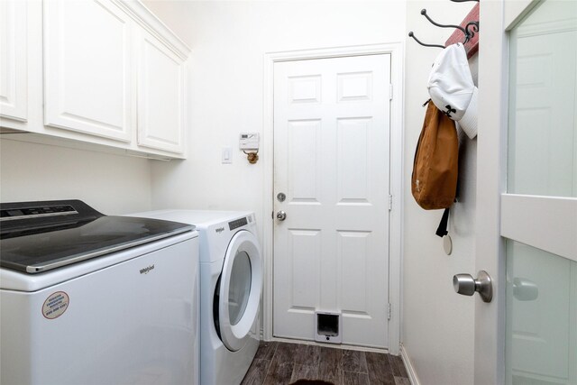 washroom featuring cabinet space, dark wood-style flooring, baseboards, and washer and clothes dryer