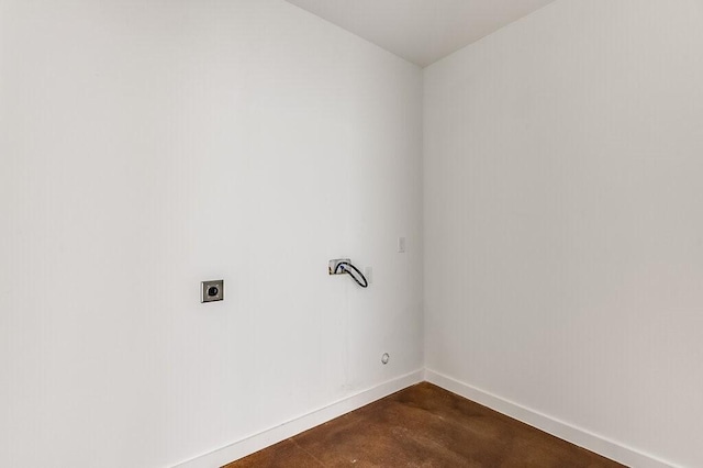 washroom featuring laundry area, baseboards, and hookup for an electric dryer