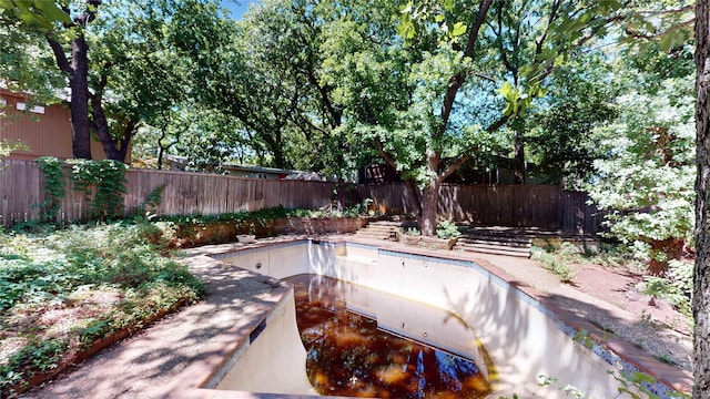 view of pool featuring a fenced backyard and a fenced in pool
