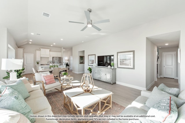 living room with a ceiling fan, visible vents, baseboards, light wood finished floors, and recessed lighting
