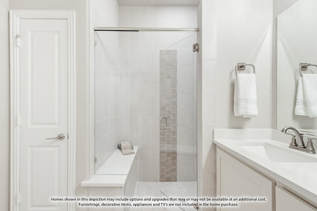 full bath featuring vanity and a shower stall