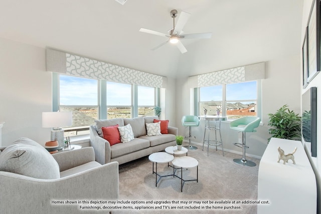 carpeted living area with ceiling fan, baseboards, and high vaulted ceiling
