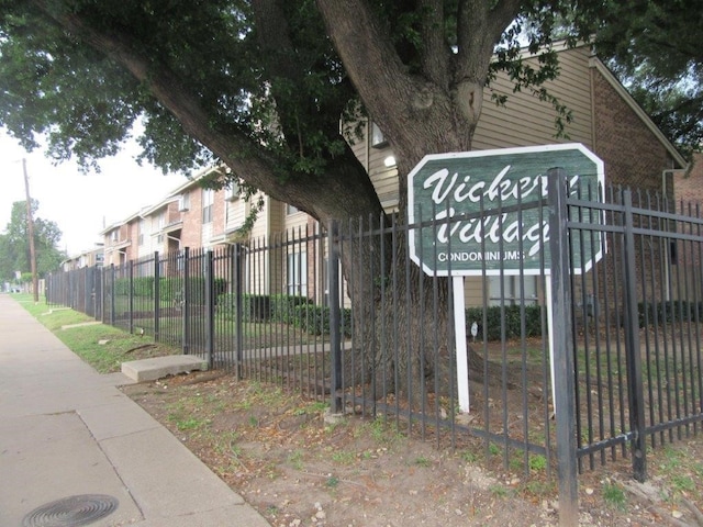 view of property's community featuring fence