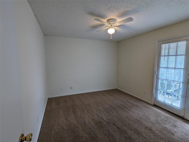 carpeted empty room featuring baseboards, a textured ceiling, and ceiling fan