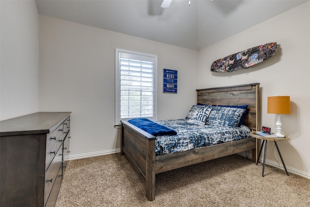 carpeted bedroom featuring baseboards and ceiling fan