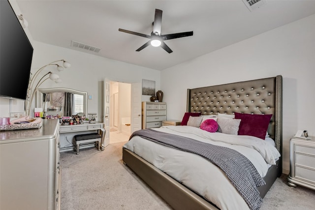 carpeted bedroom featuring connected bathroom, ceiling fan, and visible vents