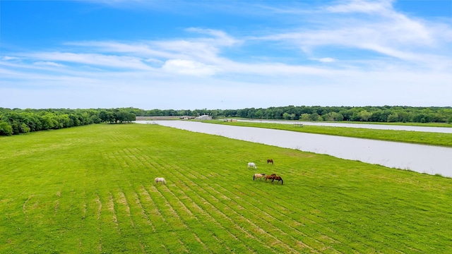 exterior space with a water view and a rural view