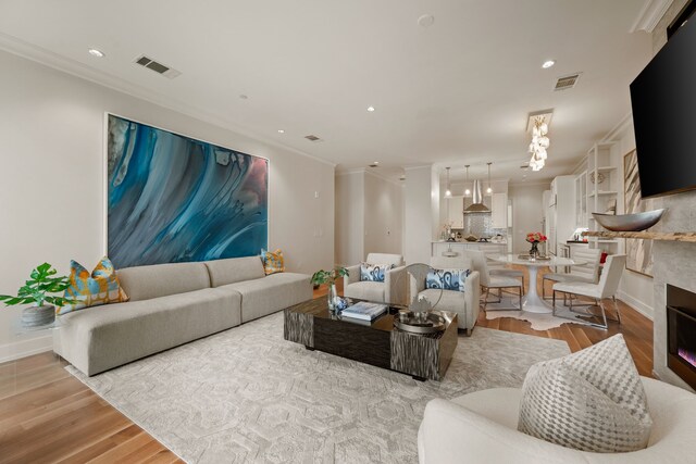 2800 Lakeside Pkwy Unit 1003, Flower Mound, TX 75022 - living room with crown molding, recessed lighting, visible vents, and light wood finished floors