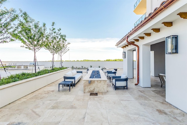 2800 Lakeside Pkwy Unit 1003, Flower Mound, TX 75022 - view of patio / terrace featuring an outdoor living space with a fire pit