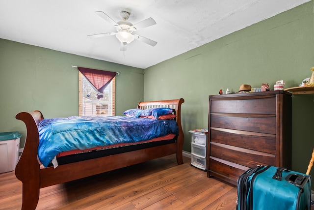 bedroom featuring ceiling fan and wood finished floors