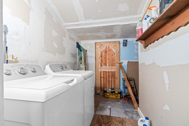 laundry area featuring separate washer and dryer and laundry area