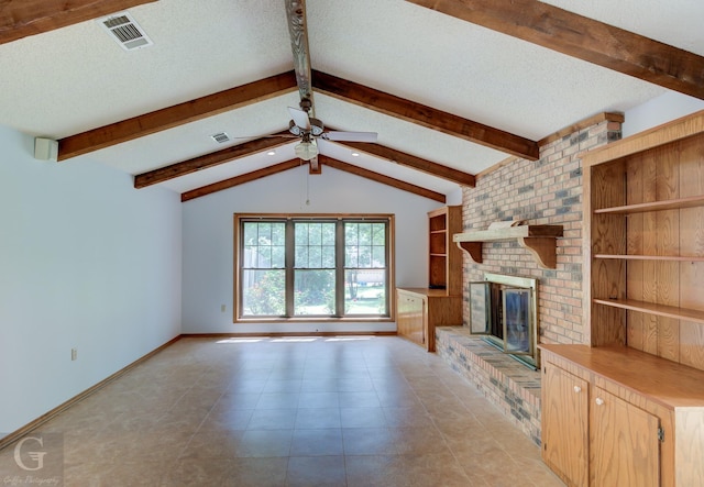 unfurnished living room with visible vents, a ceiling fan, a textured ceiling, and a fireplace