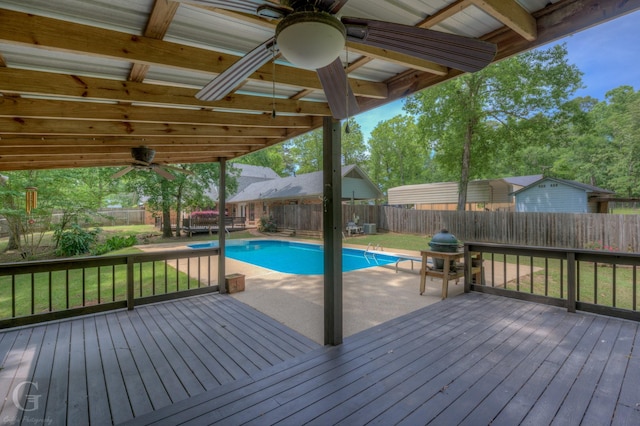 deck with a patio, a fenced backyard, ceiling fan, and a yard