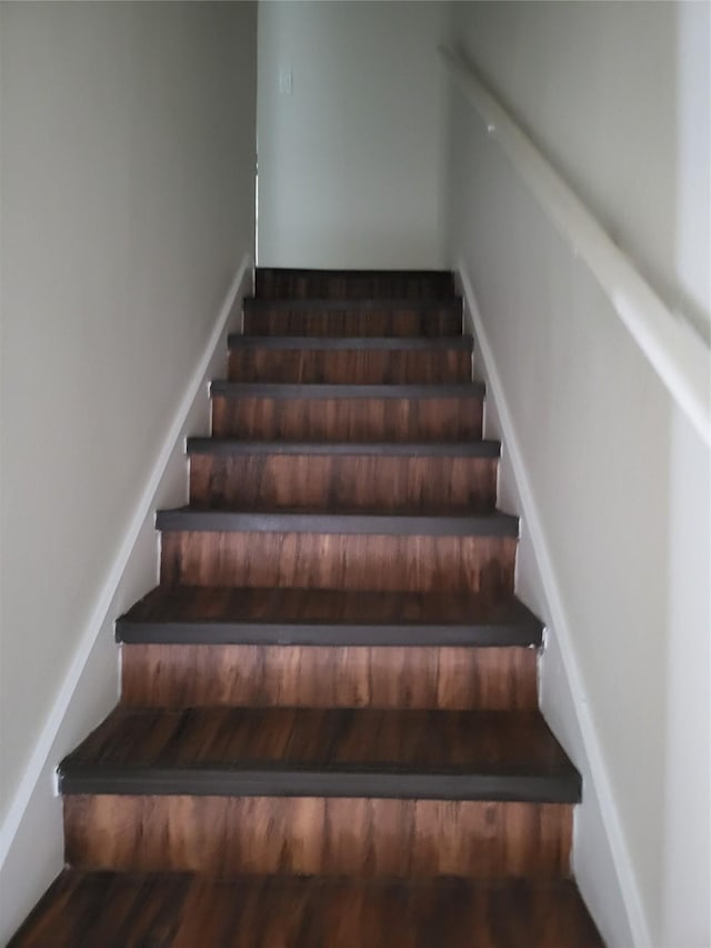 7030 Fair Oaks Ave Unit 111, Dallas, TX 75231 - stairs featuring wood finished floors
