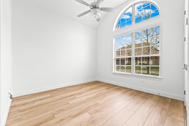 2407 Resort Dr, Heath, TX 75126 - spare room featuring light wood-style floors, baseboards, vaulted ceiling, and a ceiling fan