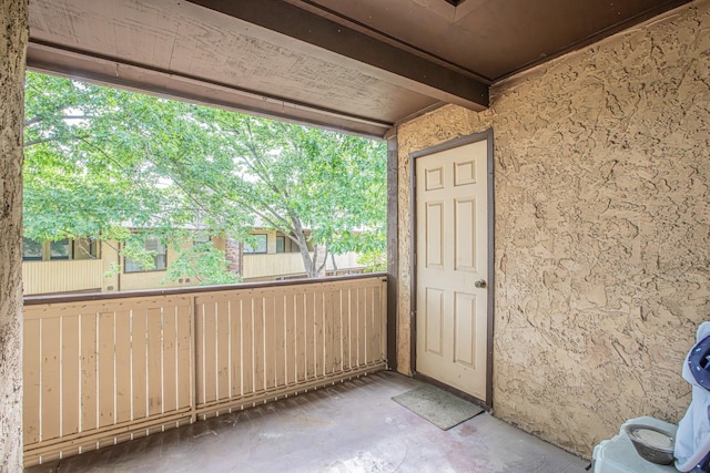 doorway to property featuring stucco siding