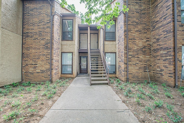 view of property featuring stairway