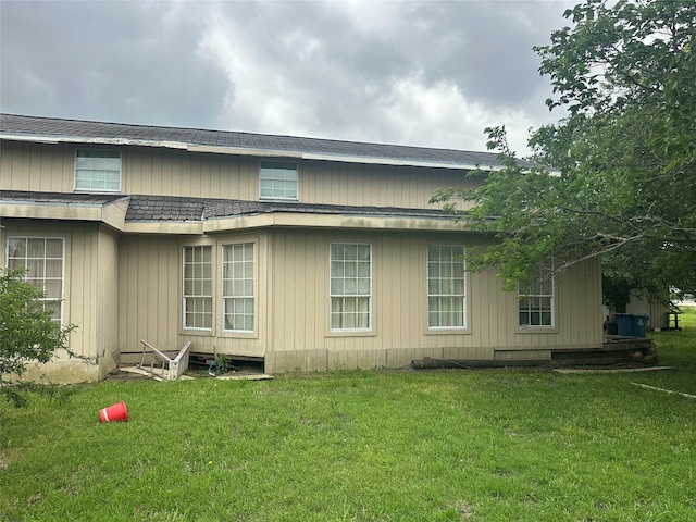 view of property exterior with a lawn