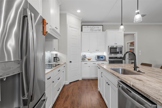 kitchen with recessed lighting, a sink, backsplash, and stainless steel appliances