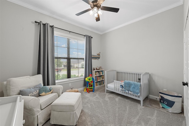 10109 Braided Briar Ln, Waco, TX 76712 - bedroom with carpet flooring, baseboards, ornamental molding, a crib, and ceiling fan