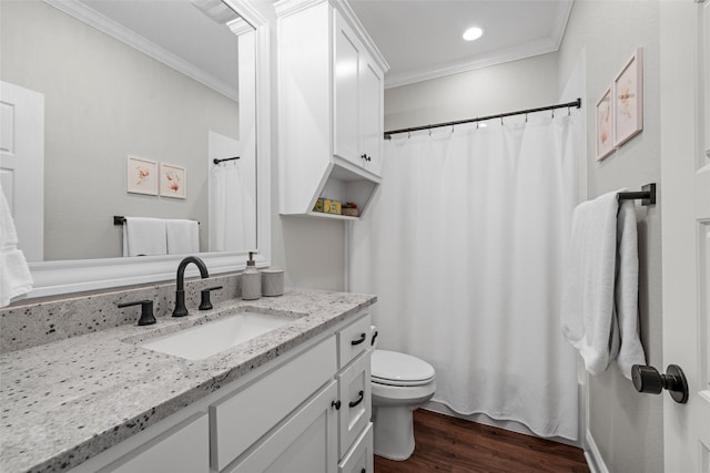 bathroom featuring vanity, ornamental molding, wood finished floors, toilet, and recessed lighting