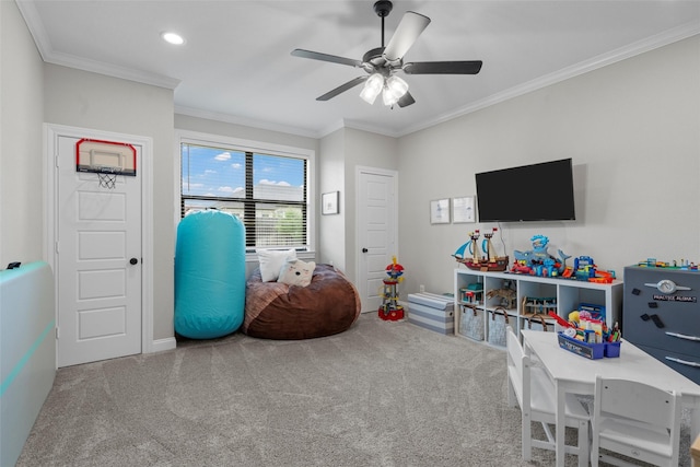 game room with crown molding, baseboards, carpet, and a ceiling fan