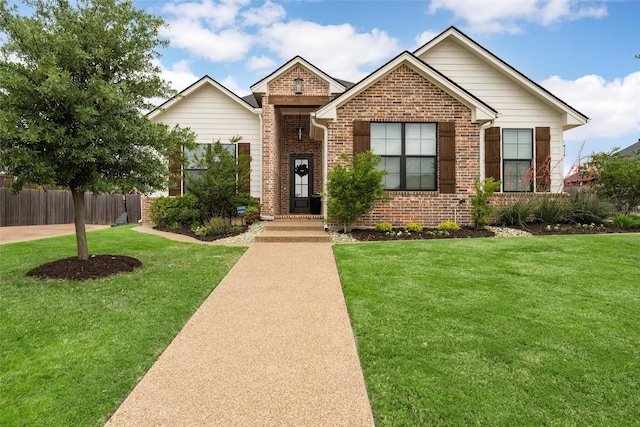single story home featuring brick siding, fence, and a front lawn