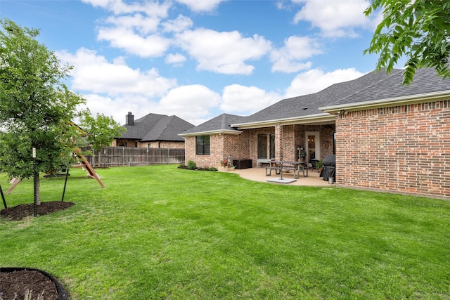 view of yard with central air condition unit, a patio area, and fence