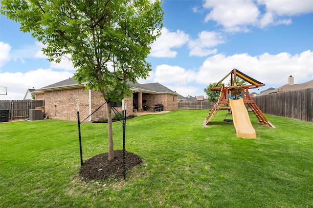 10109 Braided Briar Ln, Waco, TX 76712 - view of yard featuring central AC and a playground
