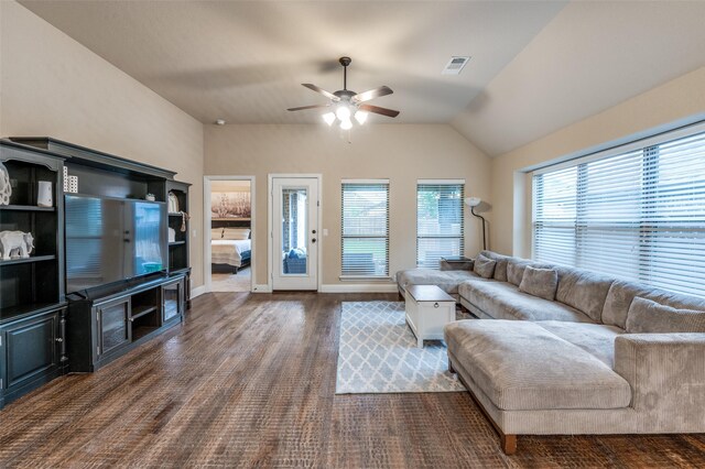 living area with visible vents, lofted ceiling, wood finished floors, baseboards, and a ceiling fan