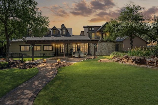 108 Dustin Cir, Hudson Oaks, TX 76087 - back of house at dusk featuring fence, a chimney, and a lawn