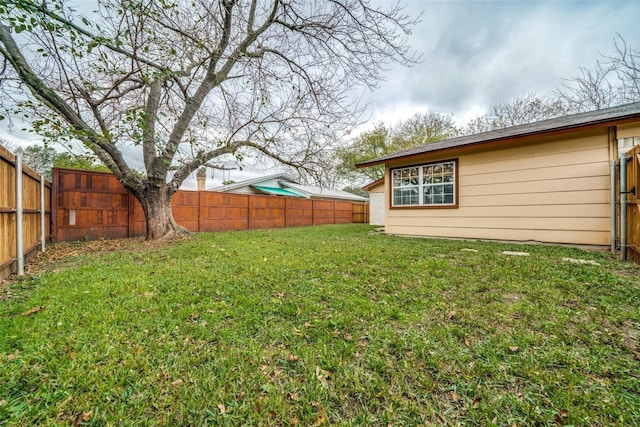 view of yard with a fenced backyard