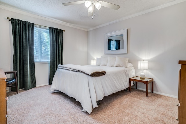 bedroom featuring baseboards, ornamental molding, a textured ceiling, and light carpet