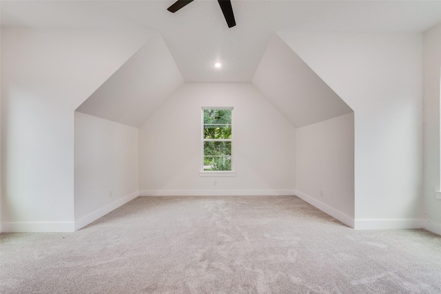 bonus room with a ceiling fan, carpet, and vaulted ceiling
