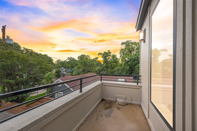 view of balcony at dusk